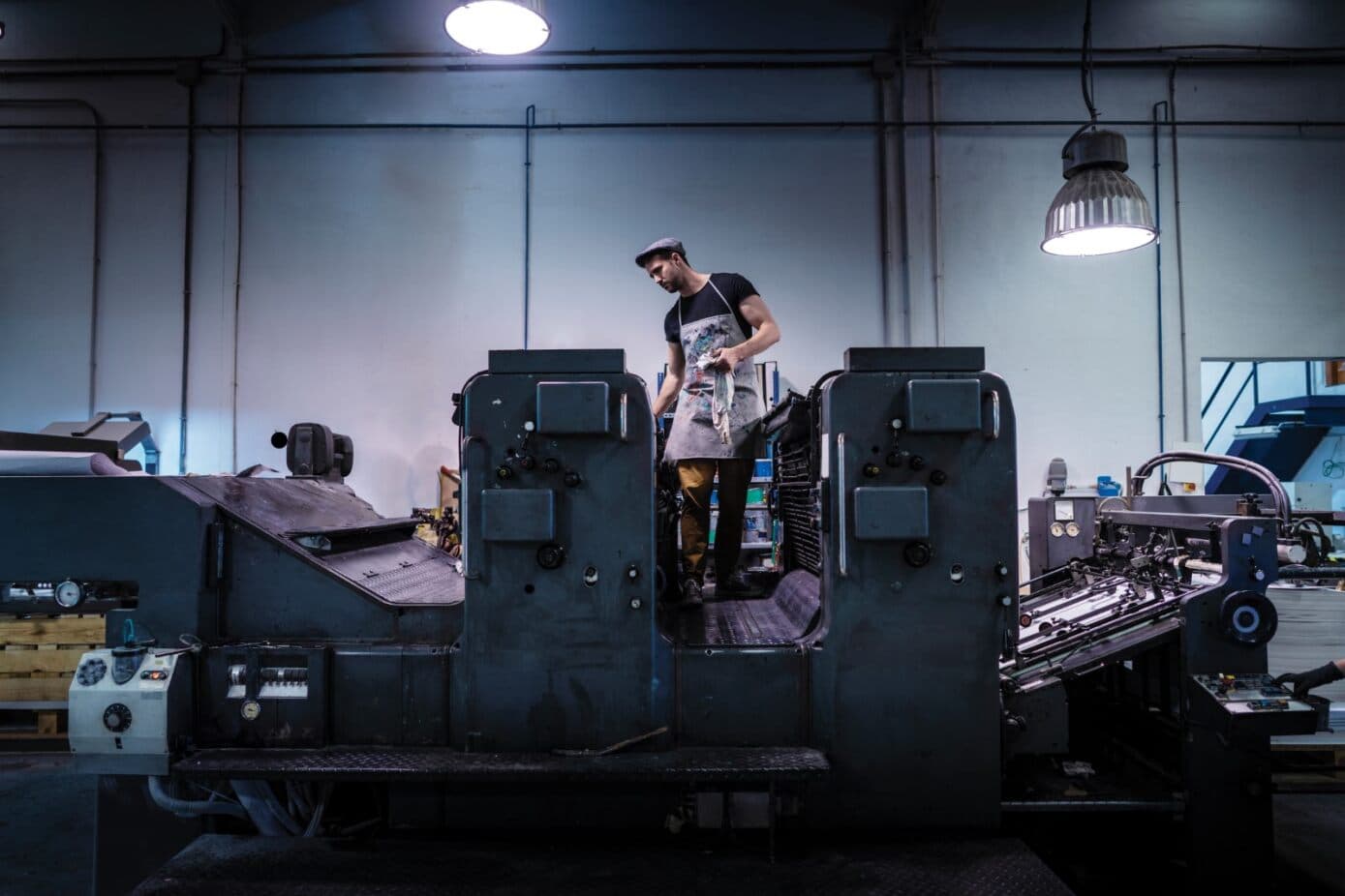 Commercial printer employee follows GMG EnviroSafe's tailored EHS solutions for safety